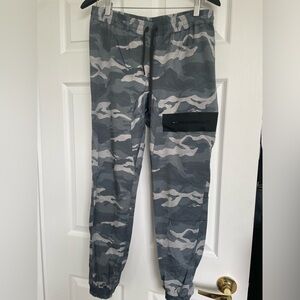 Women’s Reebok size small camo joggers. Front zip pocket. Reinforces inseam.